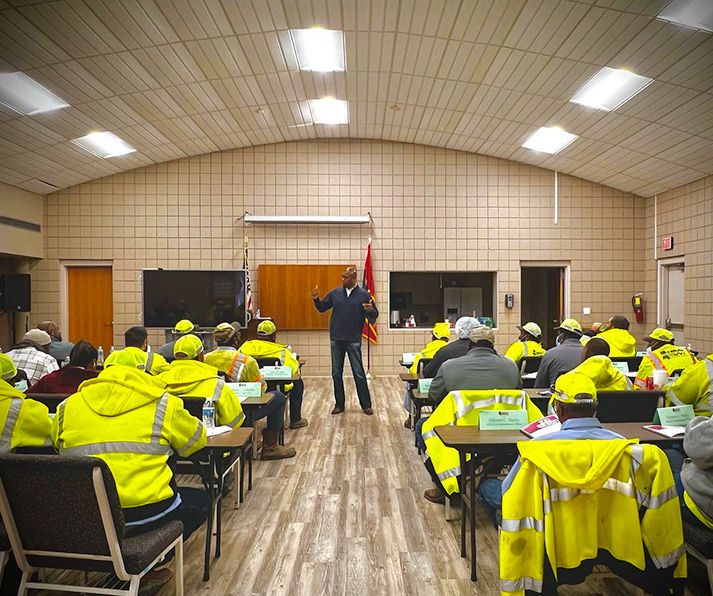 Dr. Samuel Jones leading a training session for a frontline team