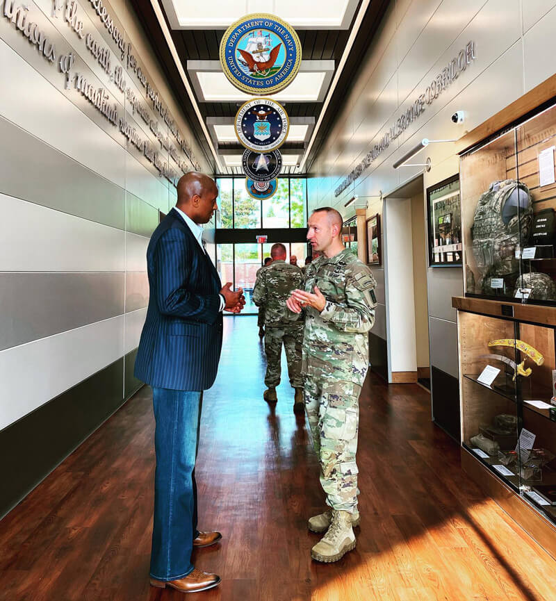 Dr. Sam speaking with a US soldier